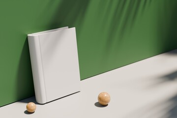 Minimal blank book mockup with wooden spheres and green background