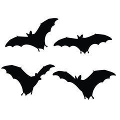Four black bat silhouettes flying in different directions on white background