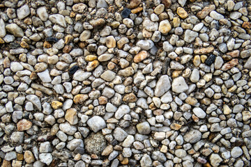 Close-up view of small natural pebbles and stones forming