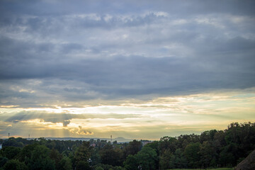 Beautiful sunset over a forest with dramatic clouds