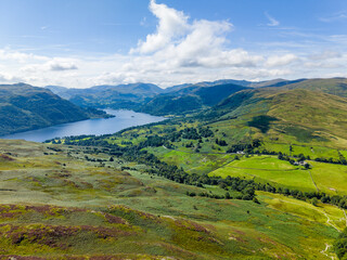 Fototapeta premium Aerial drone view of Ullswater lake and surrounding fells in the Lake District, UK