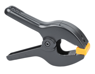 An iron clamp, isolated on a white background, for use in concepts of holding, fastening, and industrial work.