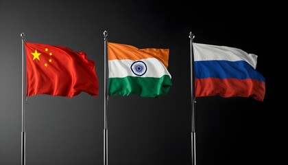 Flags of China, India and Russia on flagpoles on a black background with backlighting