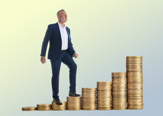 Businessman walking up coins against beige gradient background. Stacks from smaller to bigger. Path...