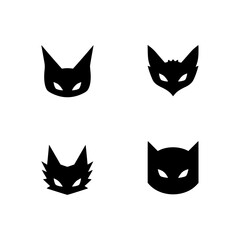 Obraz premium A minimalist set of stylized black cat silhouette mask icons against a backdrop. These vector graphics are perfect for a diverse range of applications. vector illustration