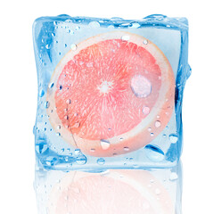 Half of fresh grapefruit inside ice cube on white background