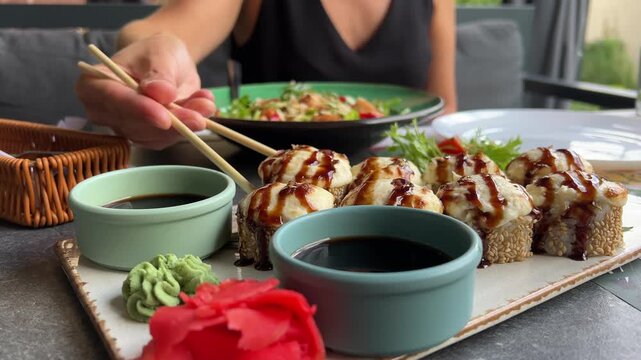 asian cuisine sushi cooking sushi at a culinary master class with a cheese cap use a torch sushi tempra baked rolls in batter and breadcrumbs with avocado the whole cooking process step by step