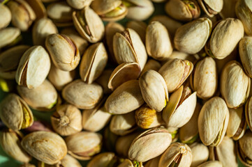 Pistachio nuts. Many pistachios in a pile.