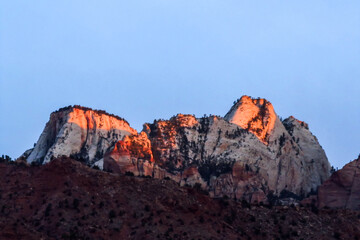 The towers of the Virgin, along the rim of Zion Canyon in Utah, in the golden light of Dawn.