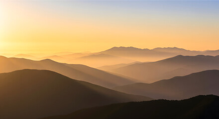 Obraz premium Golden Hour Mountains A Serene Landscape of Silhouetted Peaks at Sunset