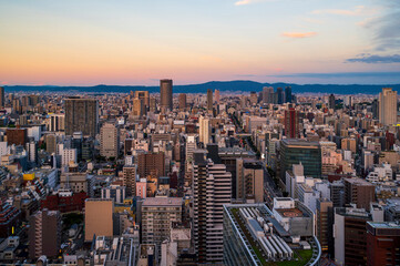 sunset or sun rise of Osaka cityscape with Skyline and office building and downtown of Osaka with twilight sky in summer season, Osaka city, Japan