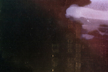 Vintage dirty grunge film texture. Aged torn black scratched photo. Glitch effect.