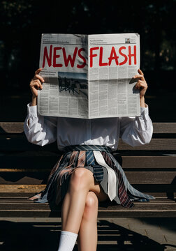 Woman Concealing Her Identity Behind a Newspaper with "News Flash" Headline