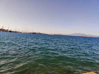 A Glimpse of Serenity: The Calm Ocean Holds a Harbor Full of Dreams, Where Every Boat Awaits a...