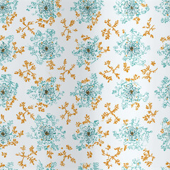 A vibrant fabric showcases intricate floral patterns in turquoise and orange hues arranged over a white background, perfect for creative sewing projects or home decor