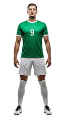 Full body portrait of a professional male soccer player in a green jersey standing confidently isolated on a white background