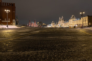Fototapeta premium Festive New Year's illumination of buildings located on Red Square in Moscow. Winter on Red Square. Paving stones on Red Square. Lighting during the New Year holidays in Moscow.