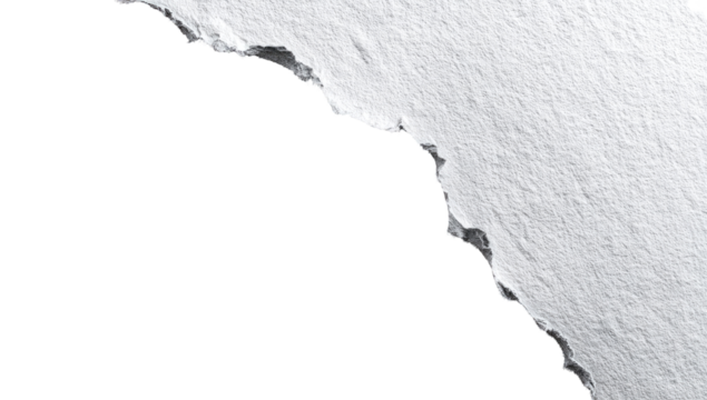 Ripped white paper edge against black background.  Close-up view of a jagged tear
