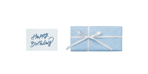 A pale blue gift box and a birthday card with blue handwritten lettering, overhead view