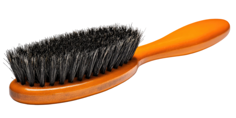 Oval-shaped brush with dark bristles and an orange handle