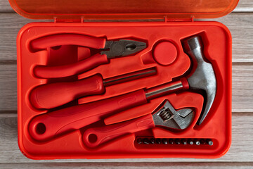 Red Plastic Tool Kit with Essential Hand Tools