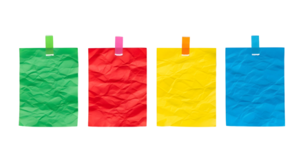 Colorful crumpled paper notes pinned with clothespins on a white background