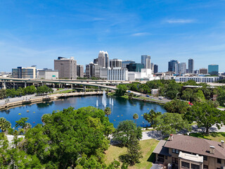 View looking over Lake Lucerne and the downtown Orlando skyline with condo and business buildings...