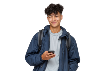 Happy young male student with backpack, holding a smartphone and smiling at the camera
