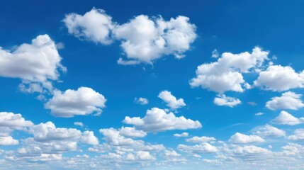 Obraz premium White Clouds Against a Bright Blue Sky