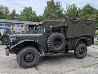 Fototapeta premium Vintage military truck parked at an outdoor exhibit showcasing historical vehicles