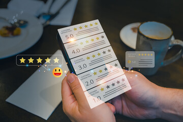 Hands holding smartphone with holographic customer satisfaction rating online review stars.Concept...