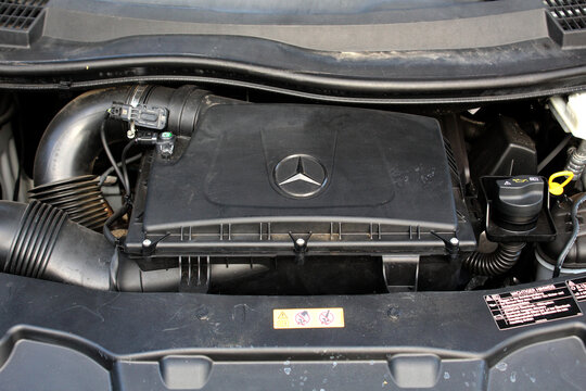 Vinnytsia, Ukraine; August 31, 2025. Close-up Mercedes-Benz Vito engine compartment with black plastic engine cover. Mercedes Vito diesel engine. Close up modern diesel engine. Passenger Van motor.