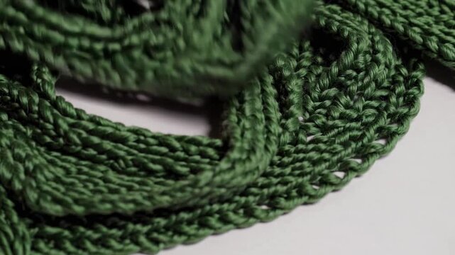 Heart-shaped form crafted from green woolen knitted scarf material