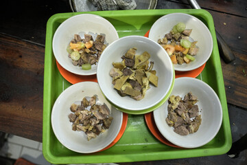 Empal Gentong is a traditional Indonesian beef soup originating from Cirebon, West Java. This savory dish is made from beef and offal cooked in a rich coconut milk broth.