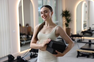 Fototapeta premium Woman with foam blocks in pilates studio