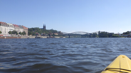 Urban landscape from a kayak on a river, water and city