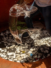 High-speed capture of a water balloon being popped with a knife, showing water splash and frozen motion. Perfect for concepts of summer, fun, energy, action, and refreshing moments