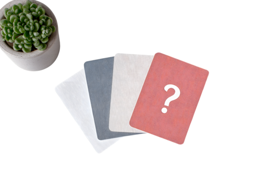  four cards, one with question mark, small potted plant in corner  isolated on white background