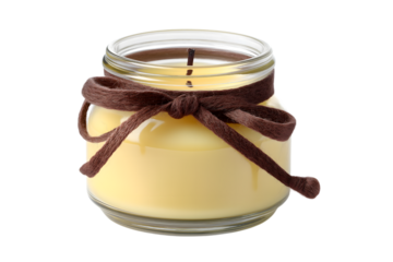 candle in a glass jar tied with ribbon isolated on white background