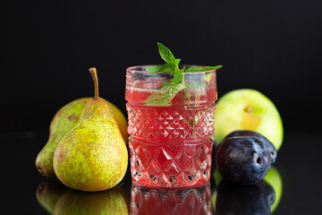 Summer homemade compote of fresh fruits on black background © Peredniankina