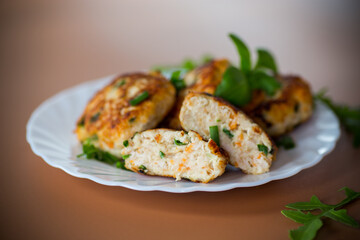 Homemade cutlets from minced chicken on a plate from above