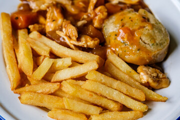Classic Delicious Chicken Casserole With a Suet Dumpling And Gravy With Chips