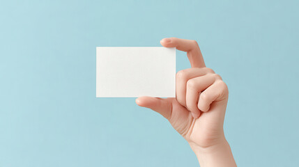 minimalist christmas celebration atmosphere in usa featuring hand holding empty greeting card against ultrabright