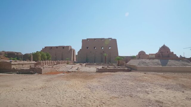Explore the majestic ruins of the Karnak Temple Complex in Luxor, Egypt, a UNESCO World Heritage site and one of the largest ancient religious sites in the world. This footage captures the grandeur an