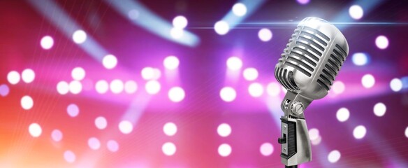 The retro silver microphone on bokeh light background
