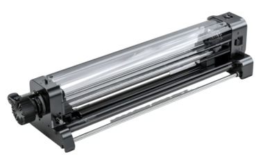Transparent mechanical device.  Long, rectangular, metallic chassis with clear plastic components. Internal parts visible.  Precisely engineered.  Industrial design