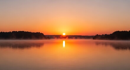 Obraz premium Sunrise over a Calm Lake.