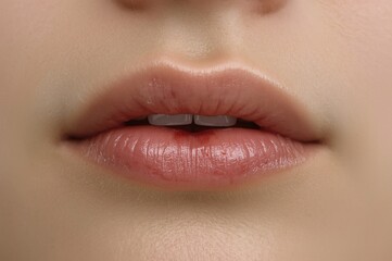 Obraz premium Close-up nude lips, slight smile, studio shot, beauty
