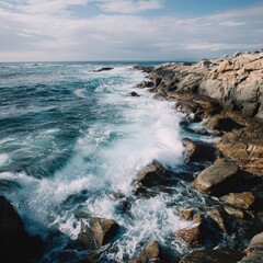 Fototapeta premium Ocean waves crashing on rocky coastline 