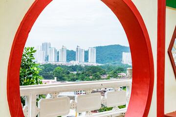 Kek lok si temple framing penang skyline, malaysia
